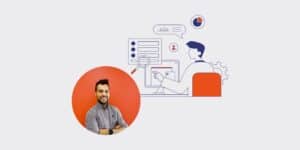 Smiling man in a gray shirt inside an orange circle beside a blue line-art illustration of a computer desk, magnifying glass, and data charts.